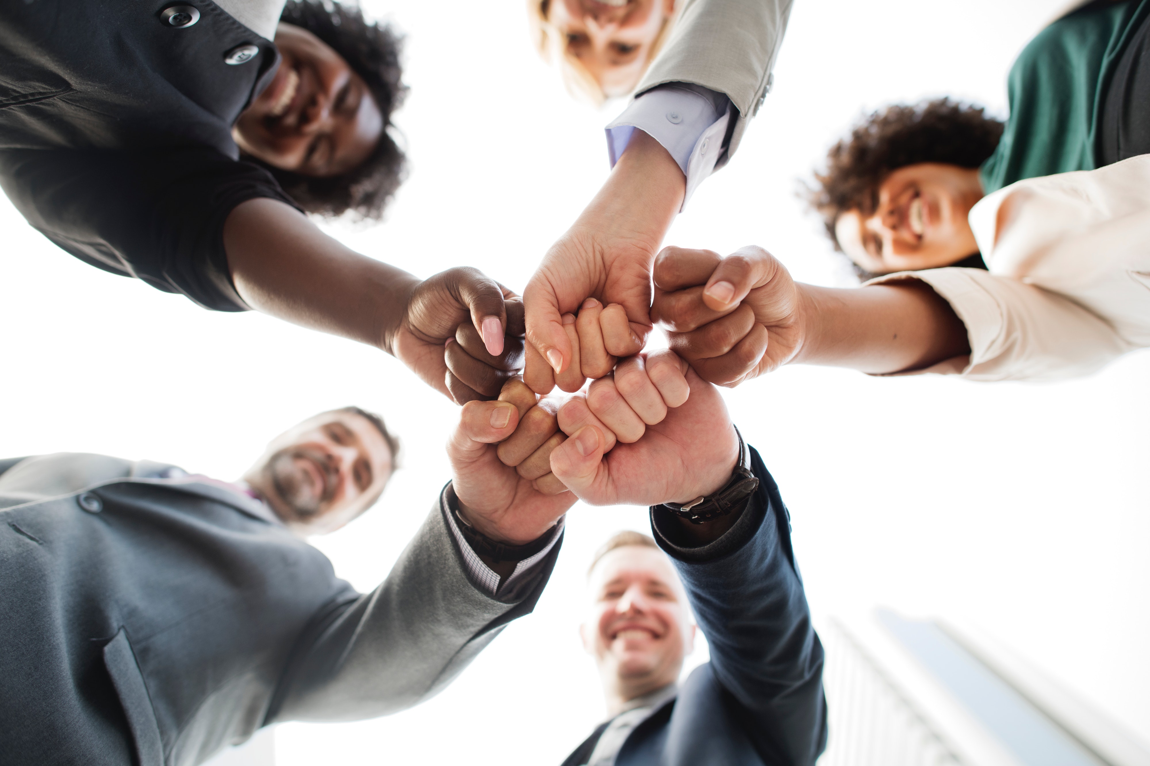 teamwork people fist bumping